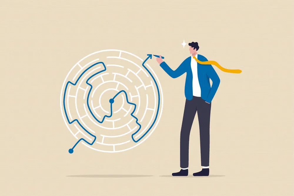 man drawing solving a labyrinth