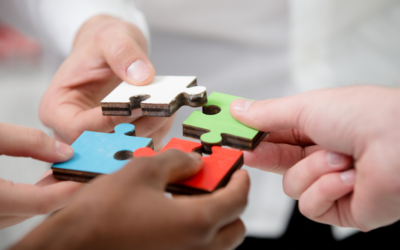 Colourful puzzle pieces are put together