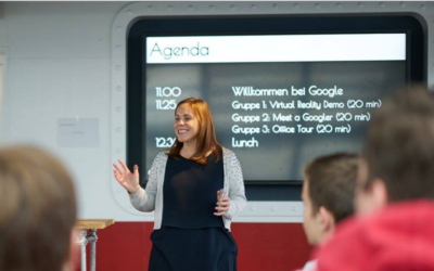 Woman teaching in front of a Smartboard