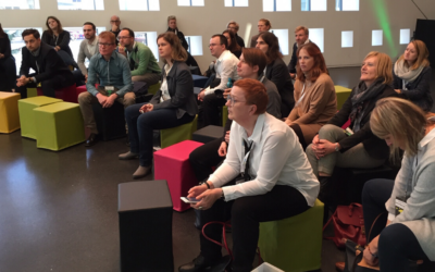 several people listening to a presentation